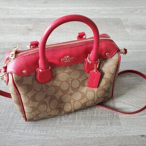 NWT Coach satchel in signature canvas, red trim